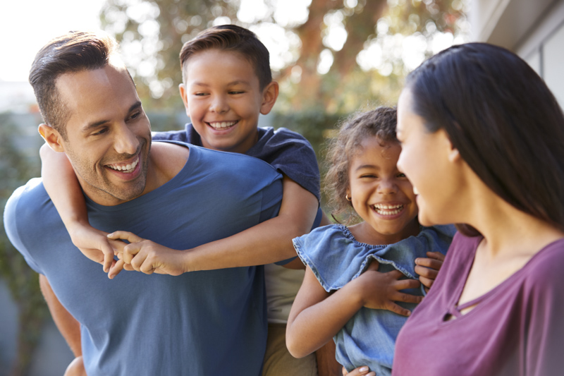 Happy Hispanic family having fun together