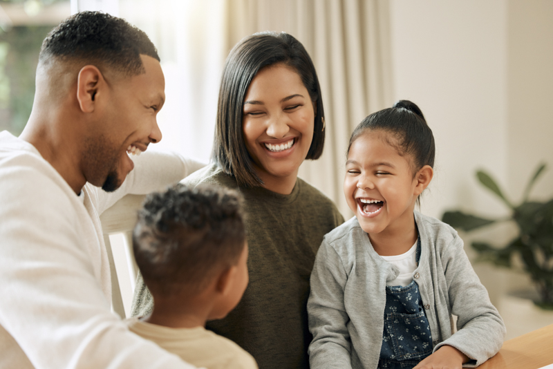 Happy Hispanic family having fun together